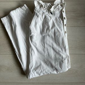 White pants with buttons and drawstring